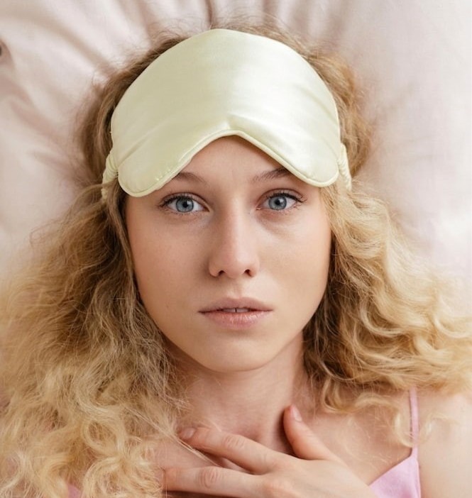 Wired but tired women awake in bed due to insomnia